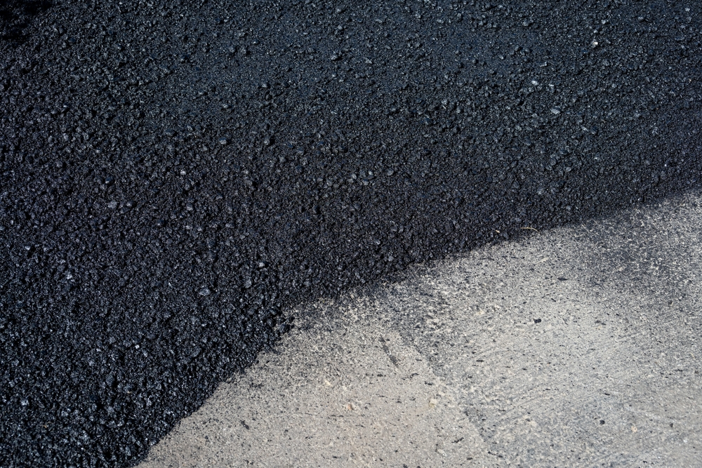 Closeup,Detail,Of,The,Transition,Between,Old,And,New,Asphalt